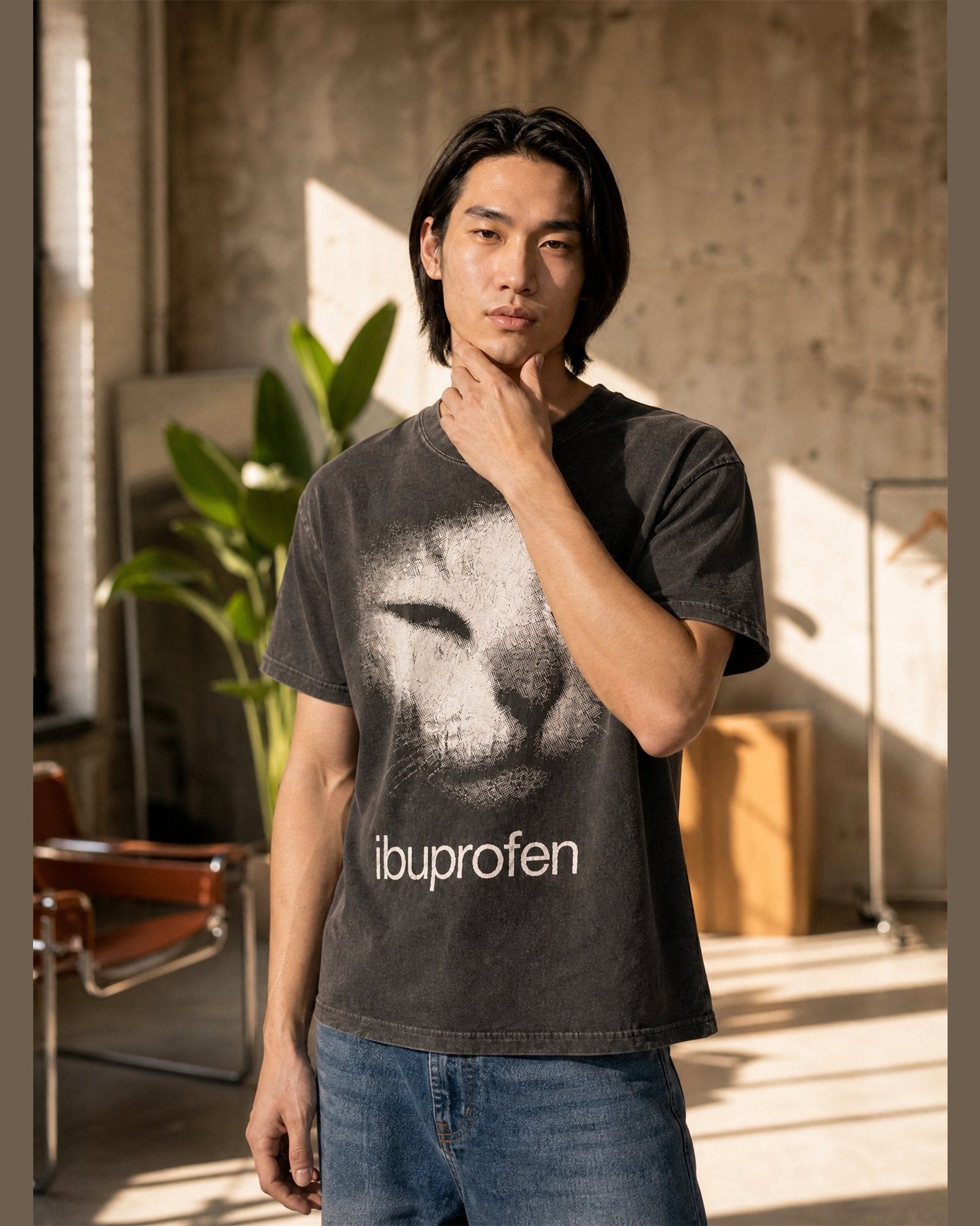 Man wearing the IBUPROFEN heavyweight boxy tee in Washed Black