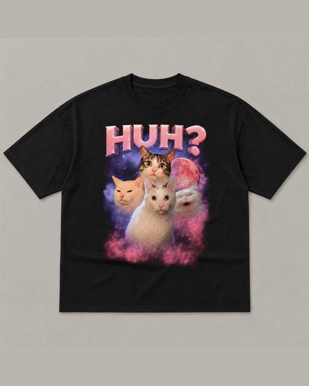 Black heavyweight tee reading HUH? in pink chrome lettering above four cats in a pink and purple space nebula