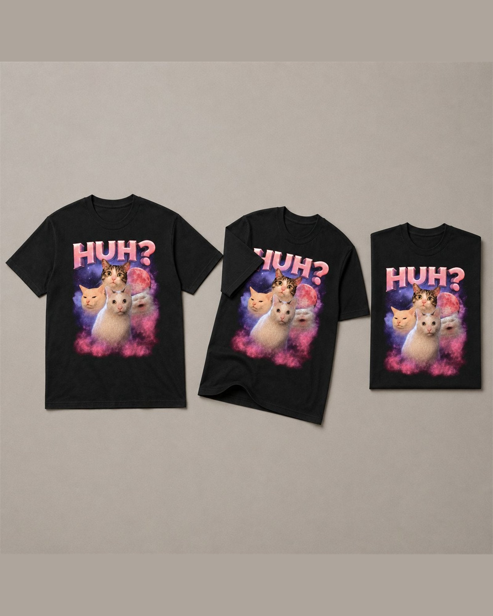 Three HUH? tees shown together in Black