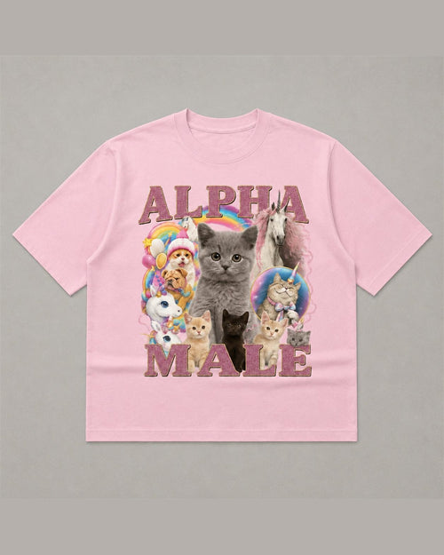 Pink heavyweight tee reading ALPHA MALE in glitter lettering around a collage of kittens, a puppy and a unicorn with rainbows