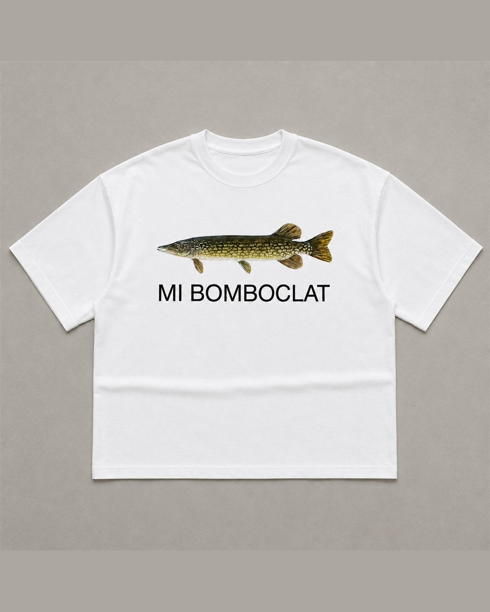 White heavyweight tee with a photographic northern pike printed across the chest above the words MI BOMBOCLAT in plain black type