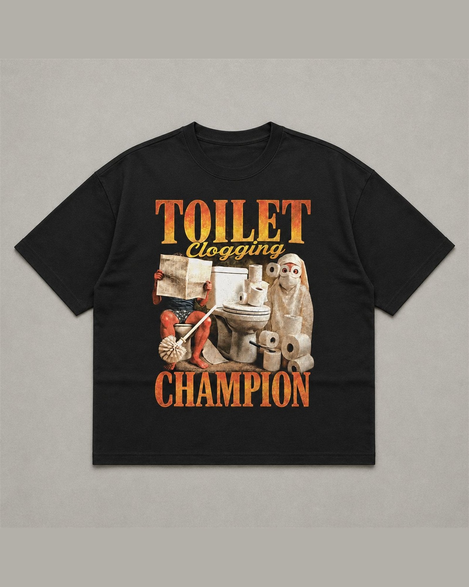 Black heavyweight tee reading TOILET CLOGGING CHAMPION in orange flame lettering around a bootleg collage of a toilet, rolls of paper and a plunger
