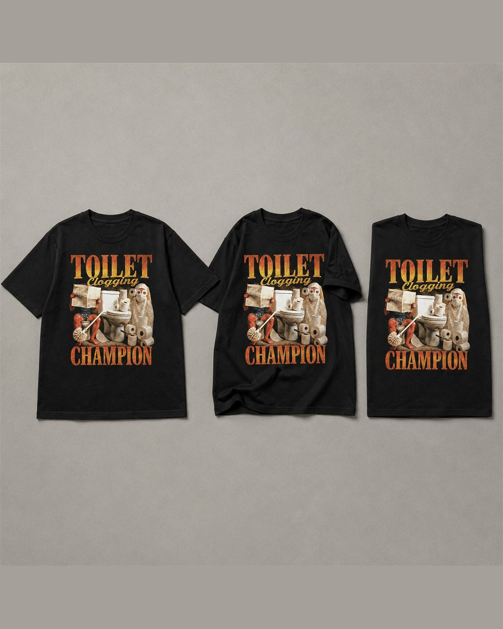 Three TOILET CLOGGING CHAMPION tees shown together in Black