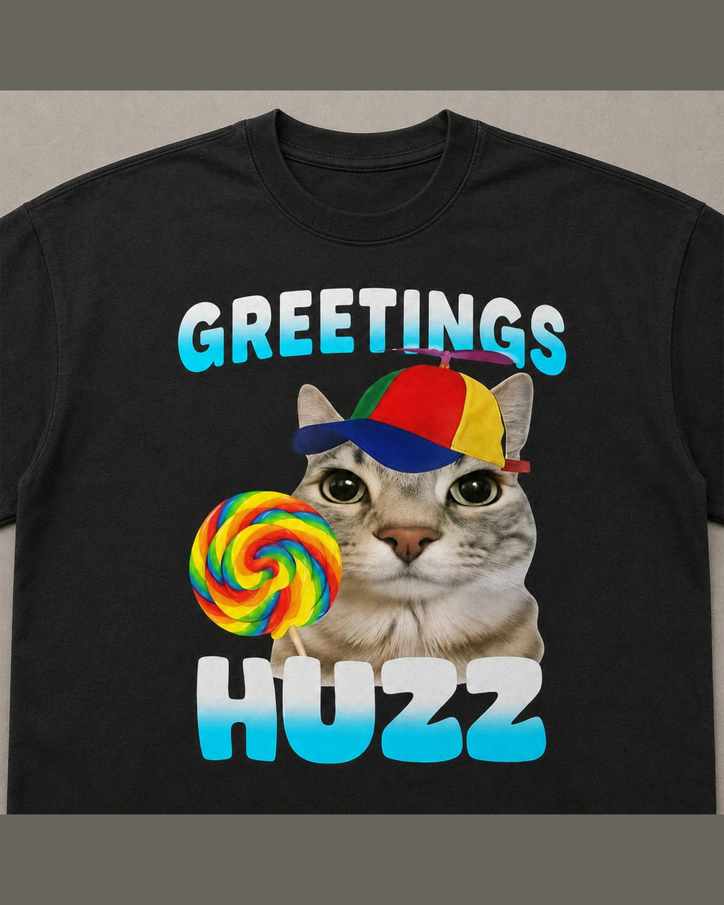 Close-up of the screen printed GREETINGS HUZZ graphic on heavyweight cotton