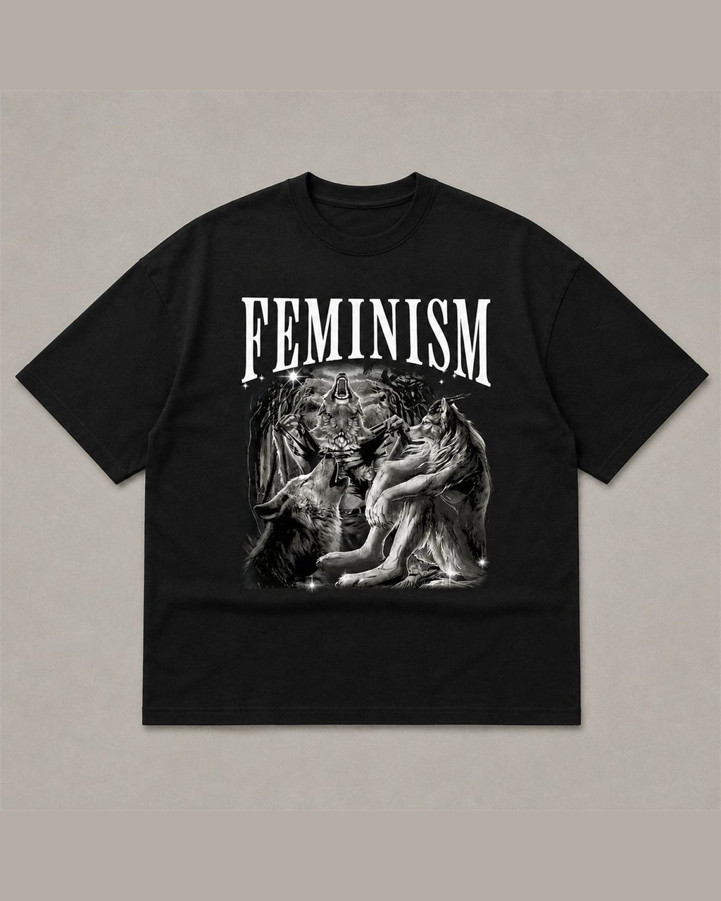 Black heavyweight tee reading FEMINISM in white serif type above a black and white airbrush illustration of howling wolves