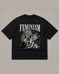 Black heavyweight tee reading FEMINISM in white serif type above a black and white airbrush illustration of howling wolves
