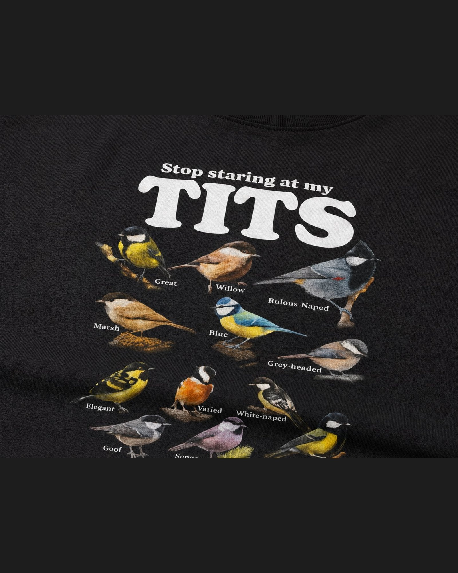 Close-up of the screen printed STOP STARING AT MY TITS graphic on heavyweight cotton