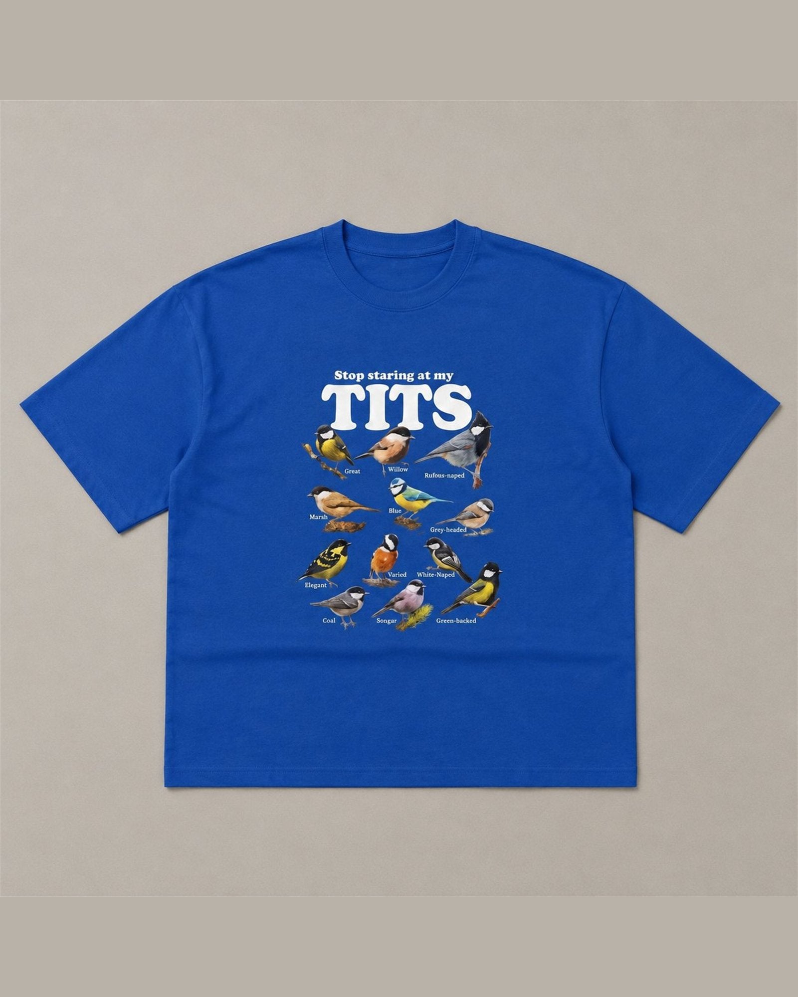 STOP STARING AT MY TITS heavyweight tee laid flat in Royal Blue