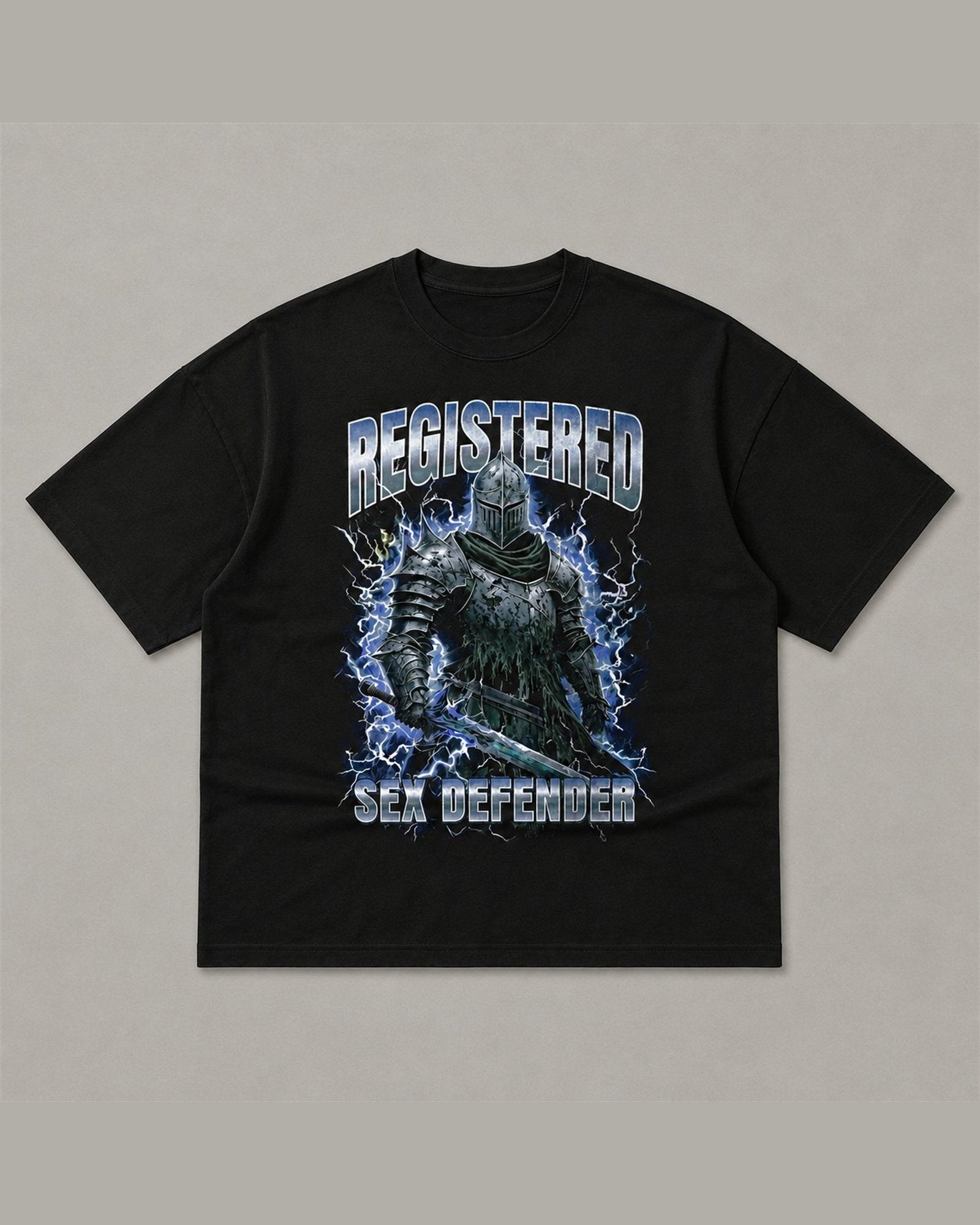 Black heavyweight tee reading REGISTERED SEX DEFENDER in chrome lettering around an armoured knight holding a sword in a lightning storm