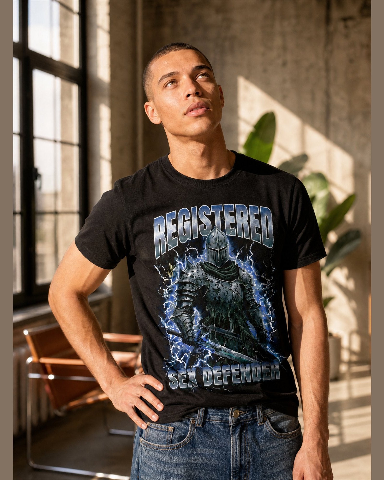 Man wearing the REGISTERED SEX DEFENDER heavyweight boxy tee in Black